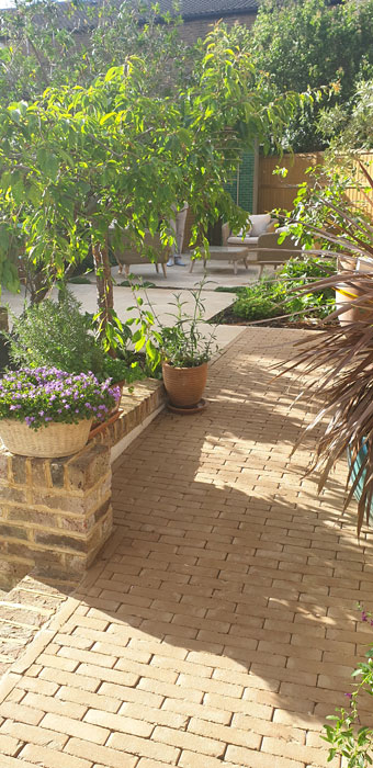 Clay pavers extend into the garden